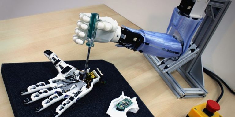 A robotic hand with a tool attached to it.