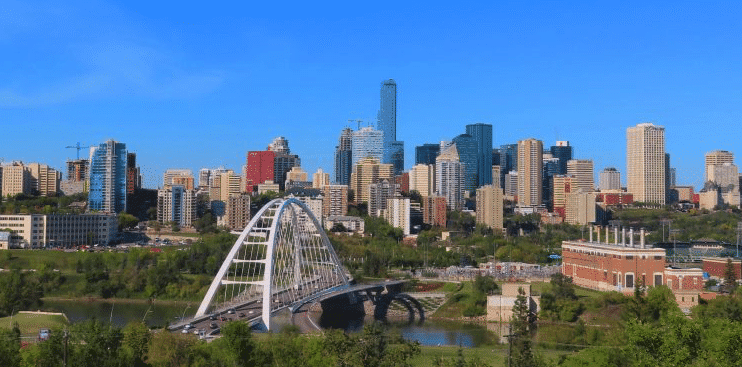 Edmonton's skyline with a bridge over a river.