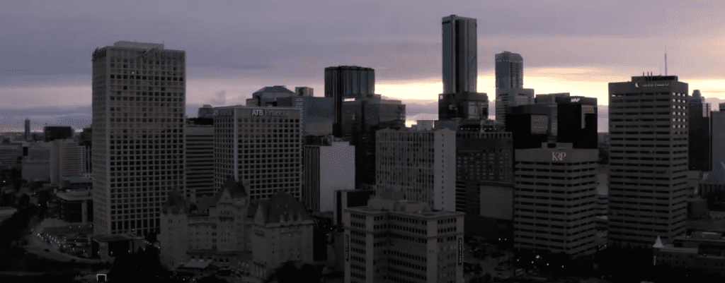 A city skyline at dusk.
