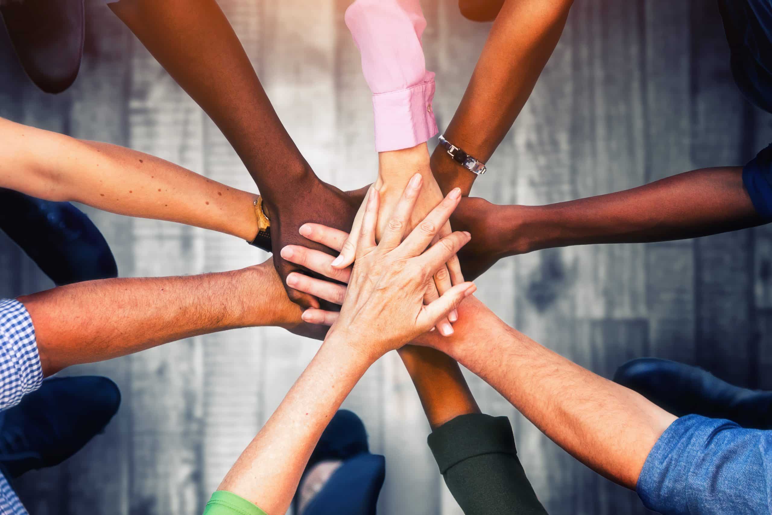 Close Up View Of Young Business People Putting Their Hands