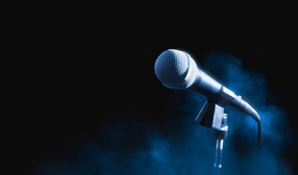 A microphone on a black background.