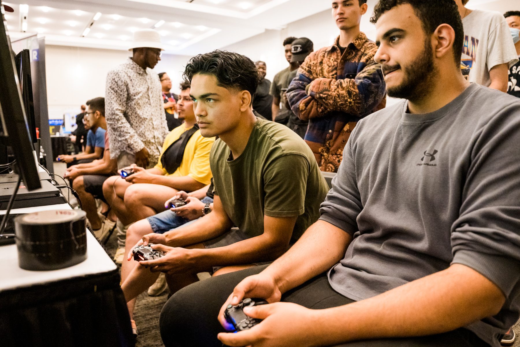 A group of people playing video games in a room.